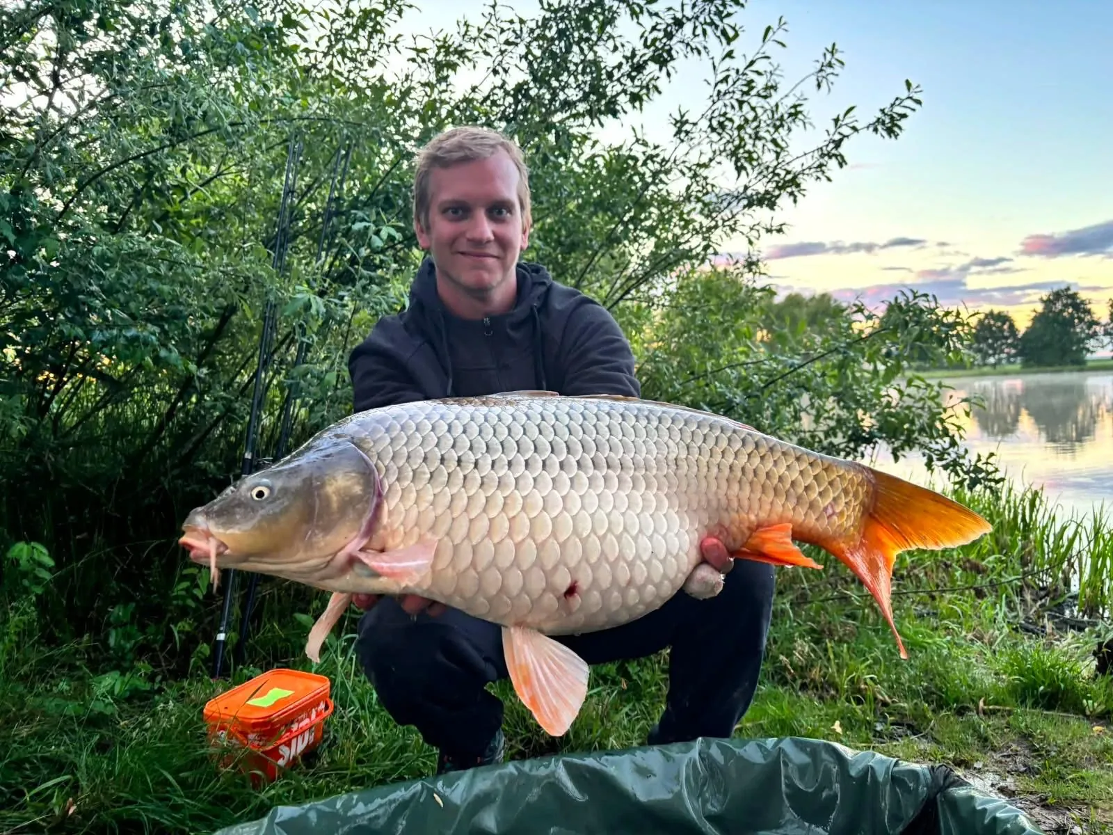 Angler with a carp from Hamr