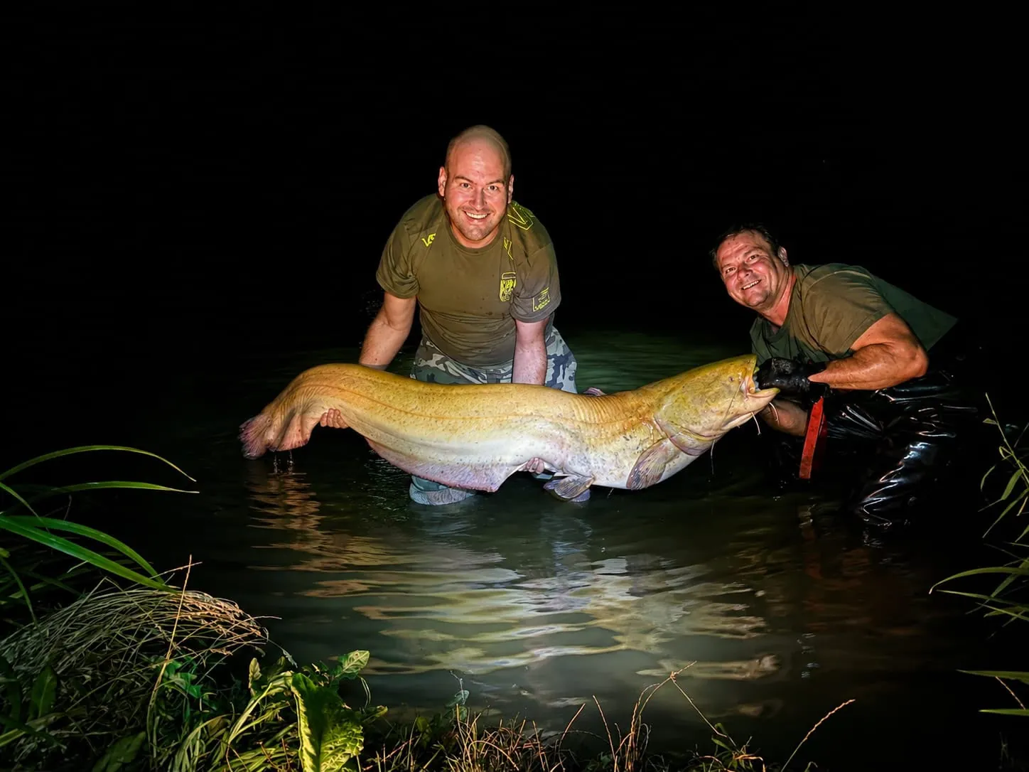 Anglers with a golden catfish from Catfish Pond
